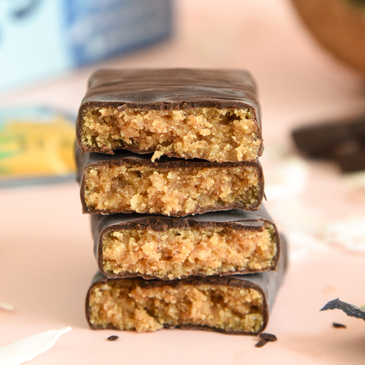 Stack of chocolate-covered bars with a close-up view of the interior filling.