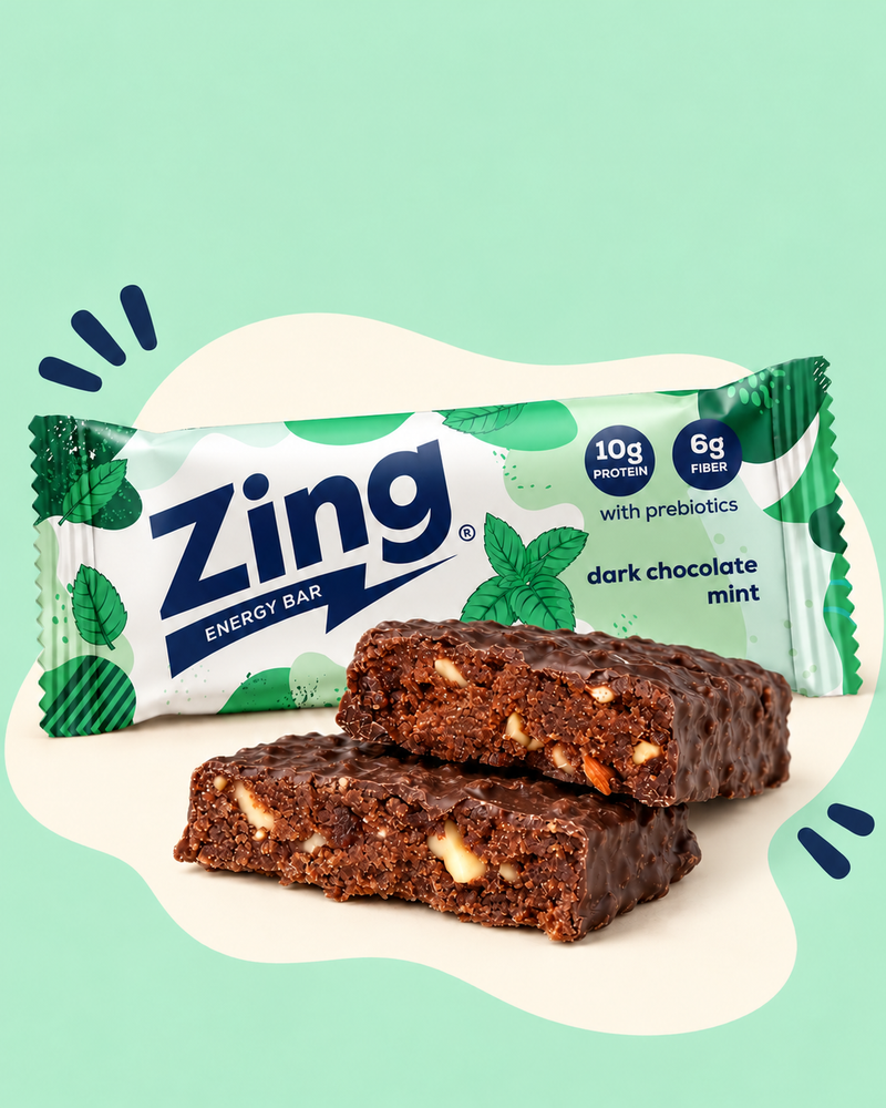 Wrapped Zing Dark Chocolate Mint bar behind two stacked bar halves showing the chocolate interior.